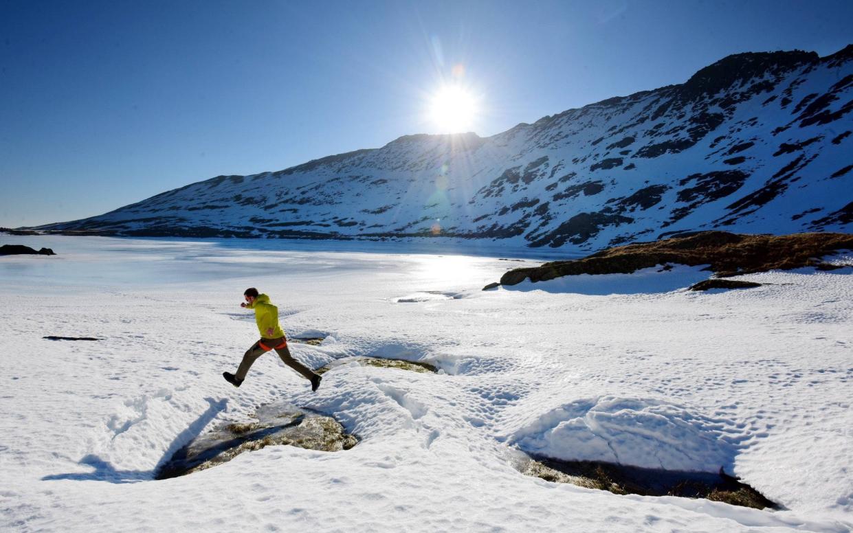 Northern exposure: Sunday walking at the frozen edges of Red Tarn on Helvellyn in the Lake District, already covered in deep snow and ice - © North News & Pictures - northnews.co.uk