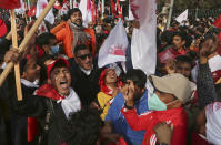 Nepalese supporters of the splinter group in the governing Nepal Communist Party participate in a protest in Kathmandu, Nepal, Friday, Jan. 22, 2021. Thousands of demonstrators rallied in Nepal’s capital Friday protesting against the prime minister who had dissolved the parliament and ordered fresh election because of feuds within the ruling political party. (AP Photo/Niranjan Shrestha)