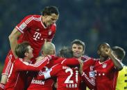 Bayern Munich's players celebrate vicotry against Borussia Dortmund during their German first division Bundesliga soccer match in Dortmund, November 23, 2013. REUTERS/Kai Pfaffenbach