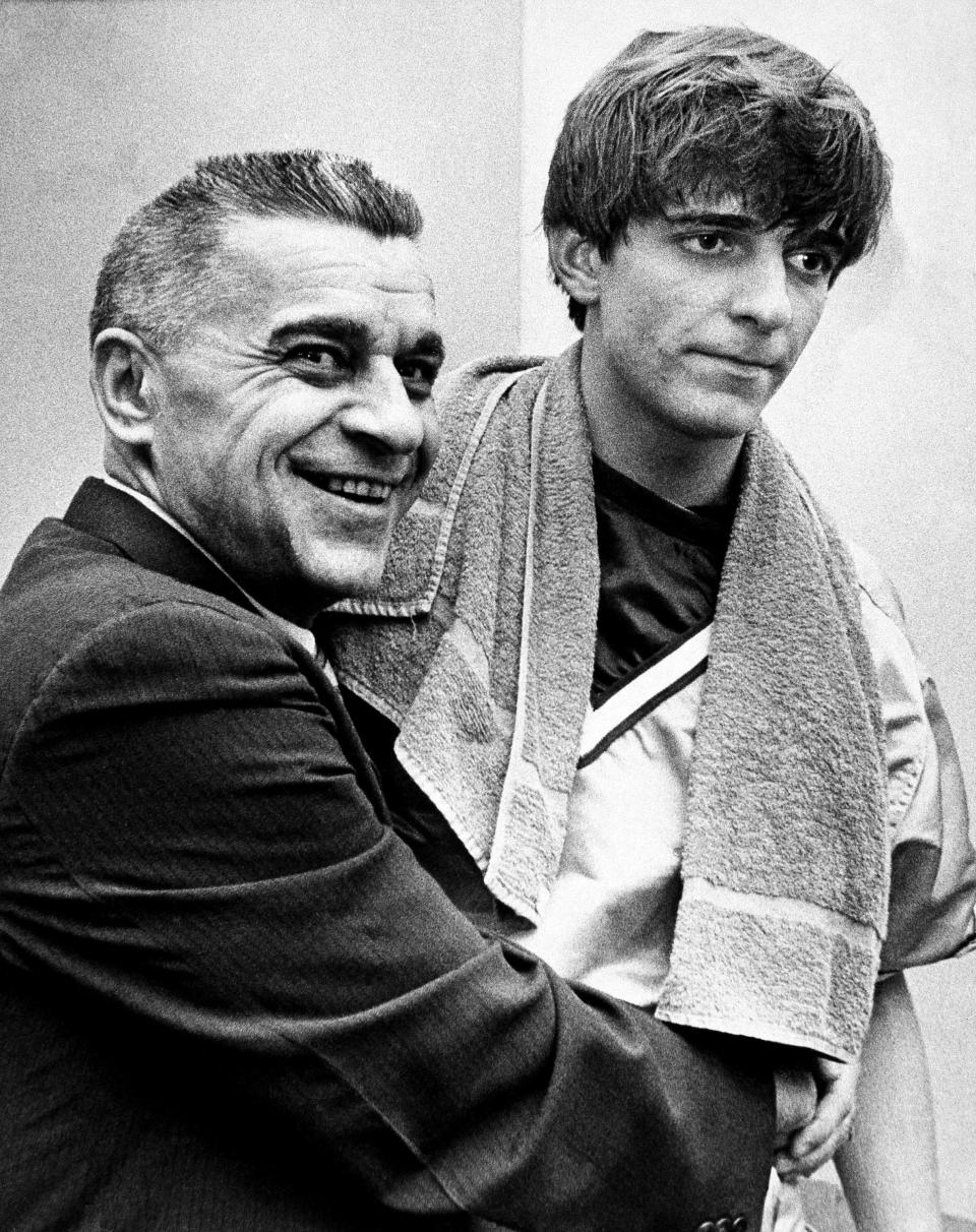 Louisiana State University basketball coach Press Maravich embraces his son Pete Maravich and asks photographers if they wanted him to kiss Pete after he broke the all-time college scoring record in Baton Rouge Saturday, Feb. 1, 1970. (AP Photo) ORG XMIT: APHS87830 [Via MerlinFTP Drop]