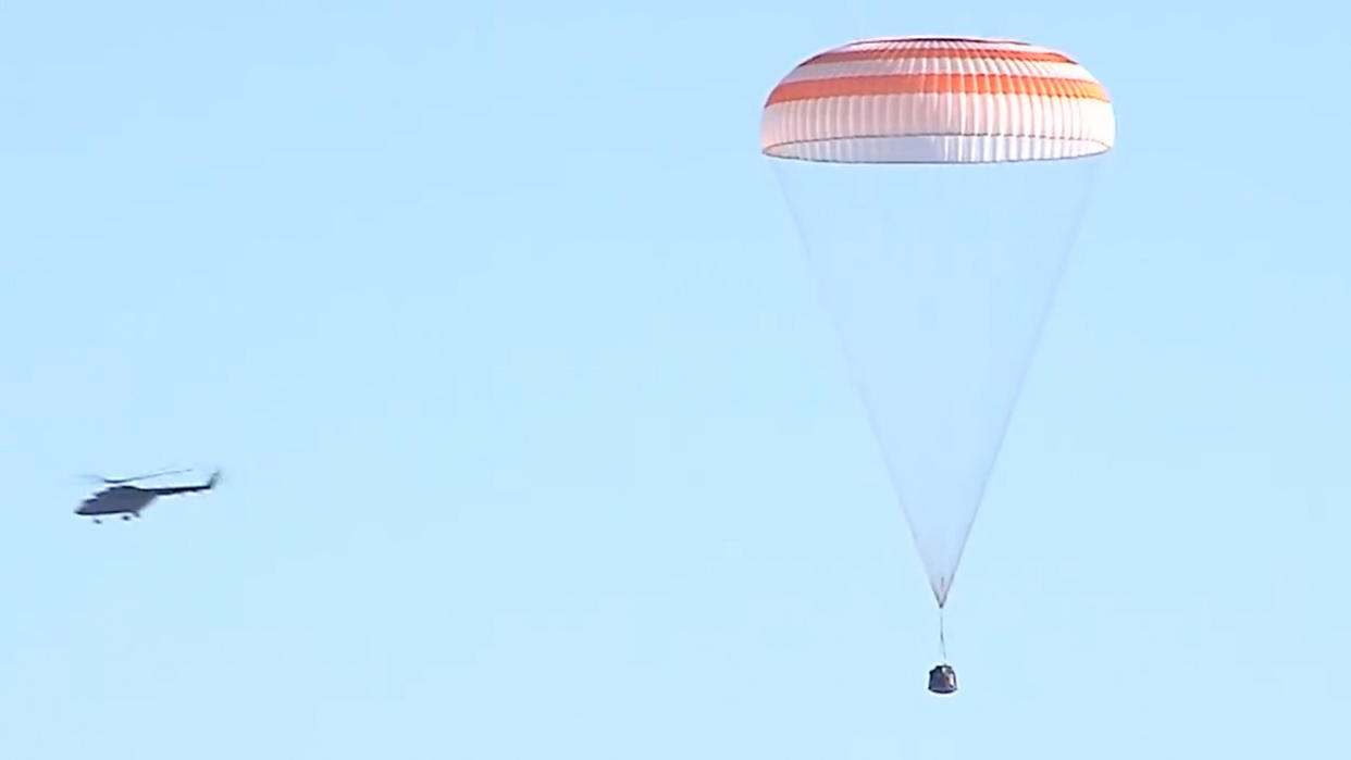  The Russian Soyuz MS-22 space capsule descends under its main parachute as it lands on the steppes of Kazakhstan on March 28, 2023. 