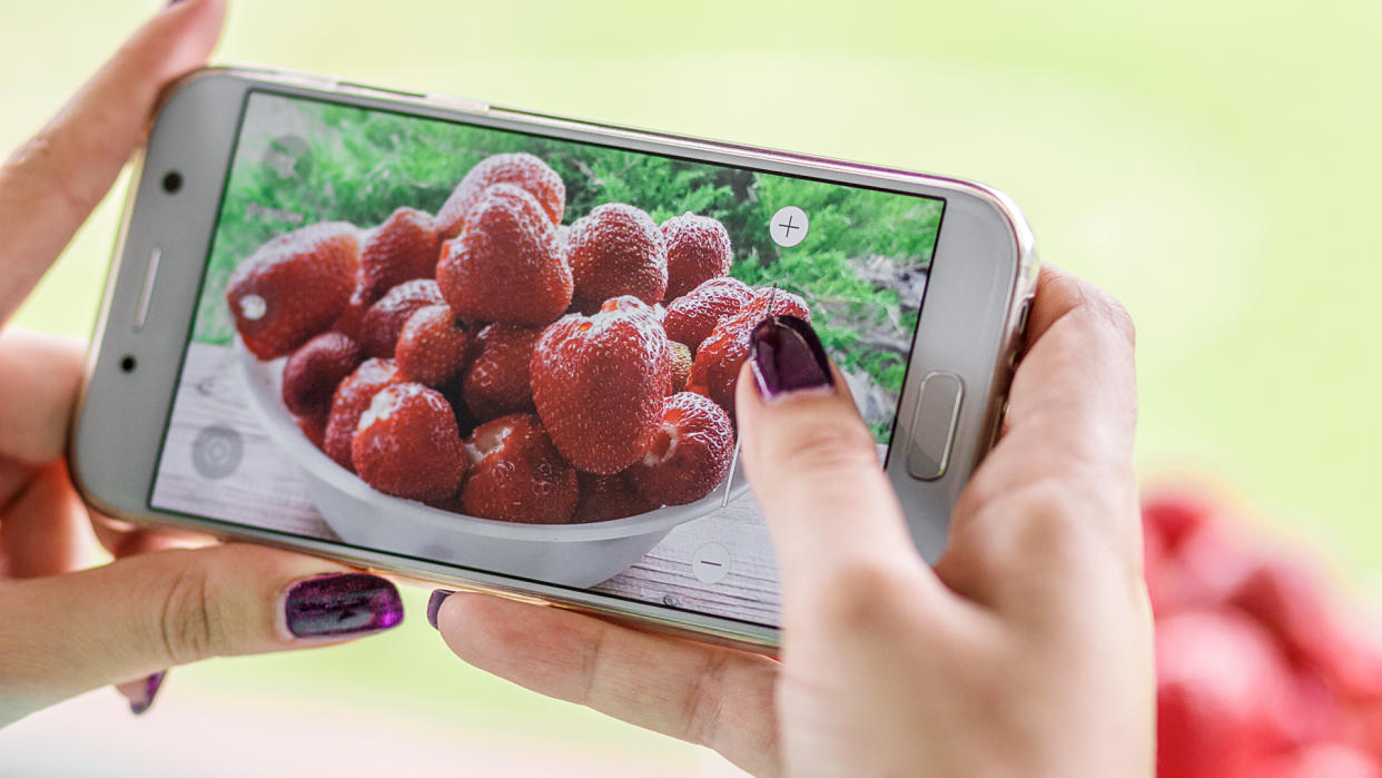 taking photos of strawberries with smartphone