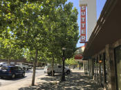 The Sutter Theater is seen on Plumas Street in Yuba City, Calif., Thursday, July 9, 2020. Sutter County was one of the first counties to reopen its economy when it defied Gov. Gavin Newsom's stay-at-home order in May to allow restaurants, hair salons, gyms and shopping malls to reopen. But Thursday, the county was added to a state watch list because of its rising number of coronavirus cases and hospitalizations. That will eventually trigger another round of restrictions, forcing bars to close and indoor operations to cease at restaurants and other public places for three weeks. (AP Photo/Adam Beam)