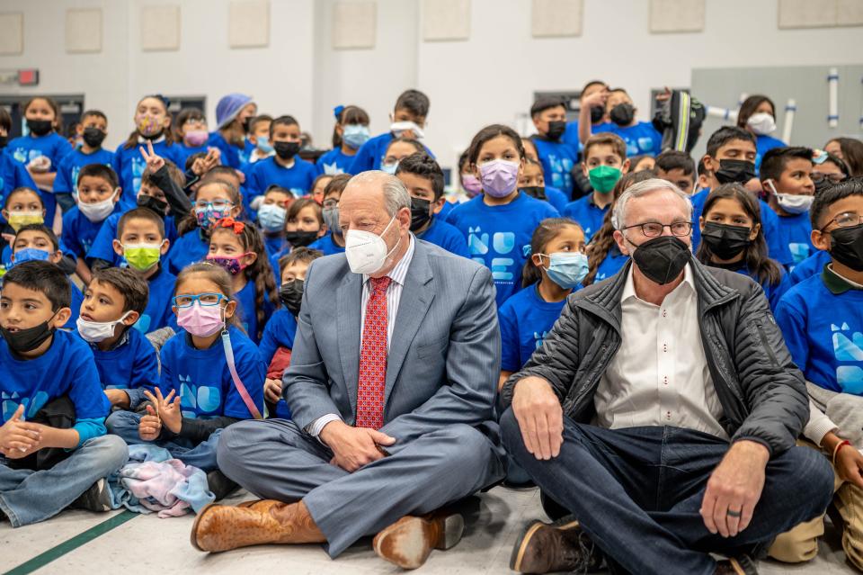 El Paso Mayor Oscar Leeser, left, and La Nube Executive Director Barry Van Deman, right, sit with students from Aoy Elementary School after announcing the new name for the children's museum Wednesday, March 23.