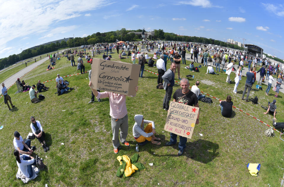 MUNICH, GERMANY - MAY 16: Demonstrators gather to protest against lockdown measures and other government policies relating to the novel coronavirus crisis on May 16, 2020 in Munich, Germany. Thousand of protesters from a wide spectrum of political creeds, from the simply disgruntled to conspiracy enthusiasts, gathered in cities nationwide to protest against government policies and measures many decry as disproportionate and undemocratic. Germany has been easing lockdown measures over recent weeks in an ongoing process. (Photo by Hannes Magerstaedt/Getty Images)