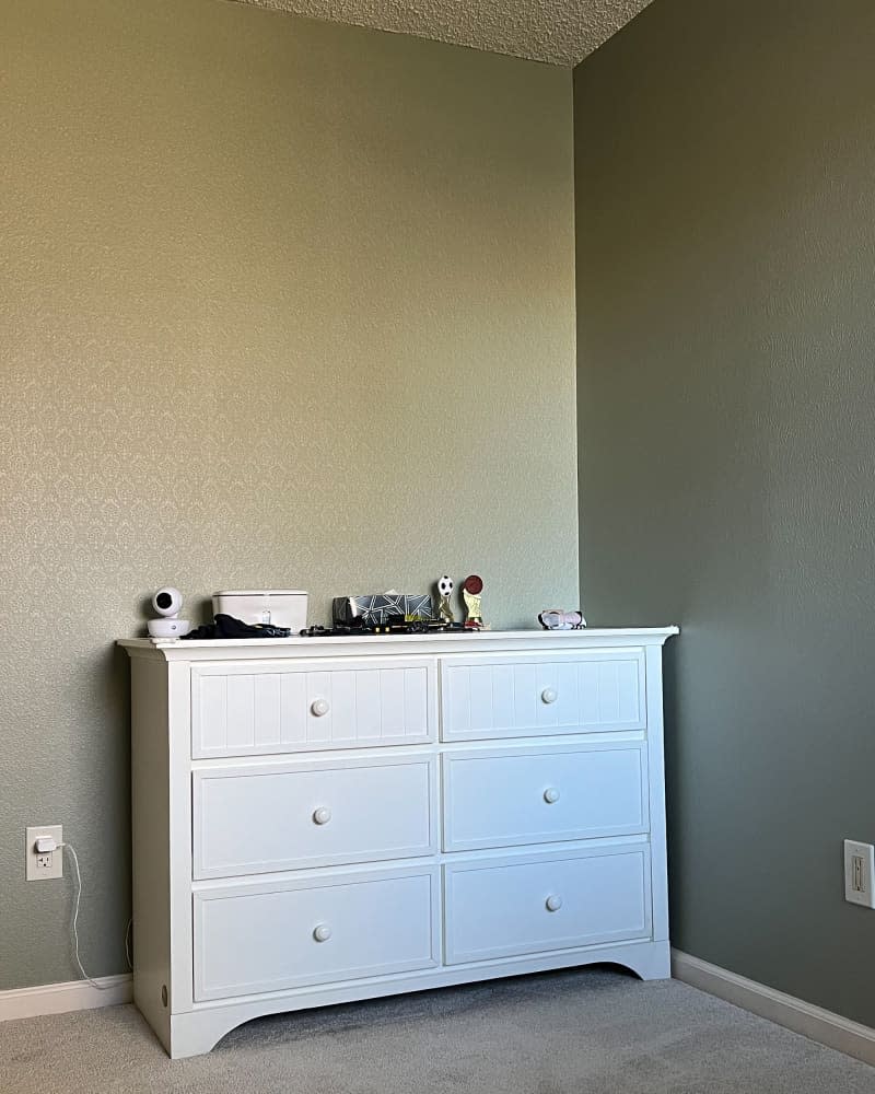 White dresser in child's room before renovation.