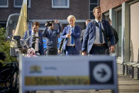 Geert Wilders, leader of the Dutch Party for Freedom, center, arrives at a polling station to cast his vote in the European elections in The Hague, Netherlands, Thursday, May 23, 2019. (AP Photo/Phil Nijhuis)