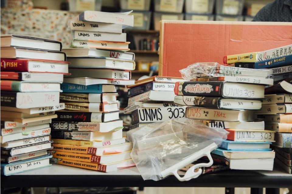 Stacks of books are organized in Binh Thai's classroom at the University Neighborhood Middle School in New York City.