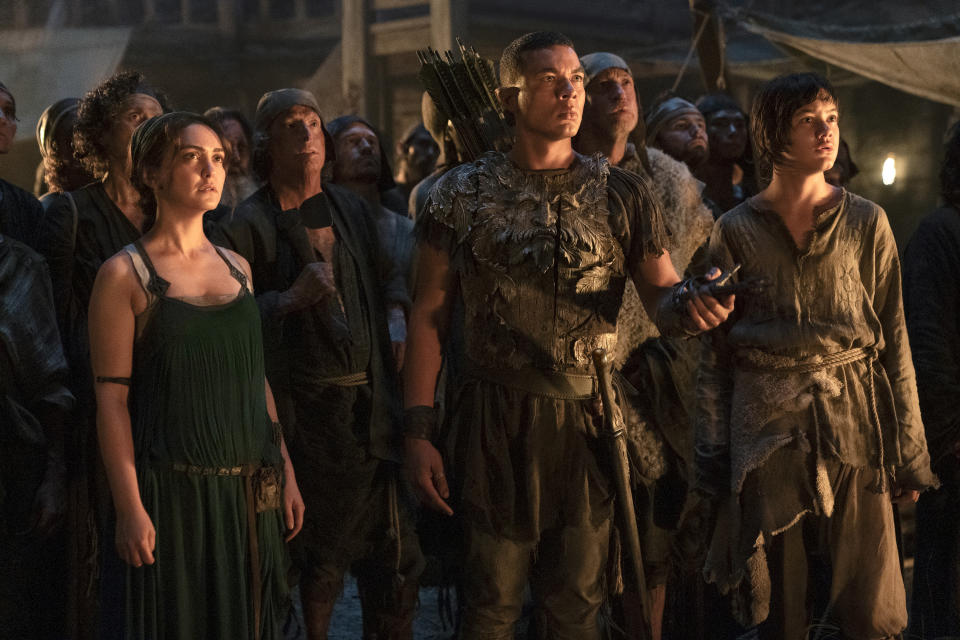 This image released by Amazon Studios shows a scene Nazanin Boniadi, from left, Ismael Cruz Cordova and Tyroe Muhafidin from "The Lord of the Rings: The Rings of Power." (Amazon Studios via AP)