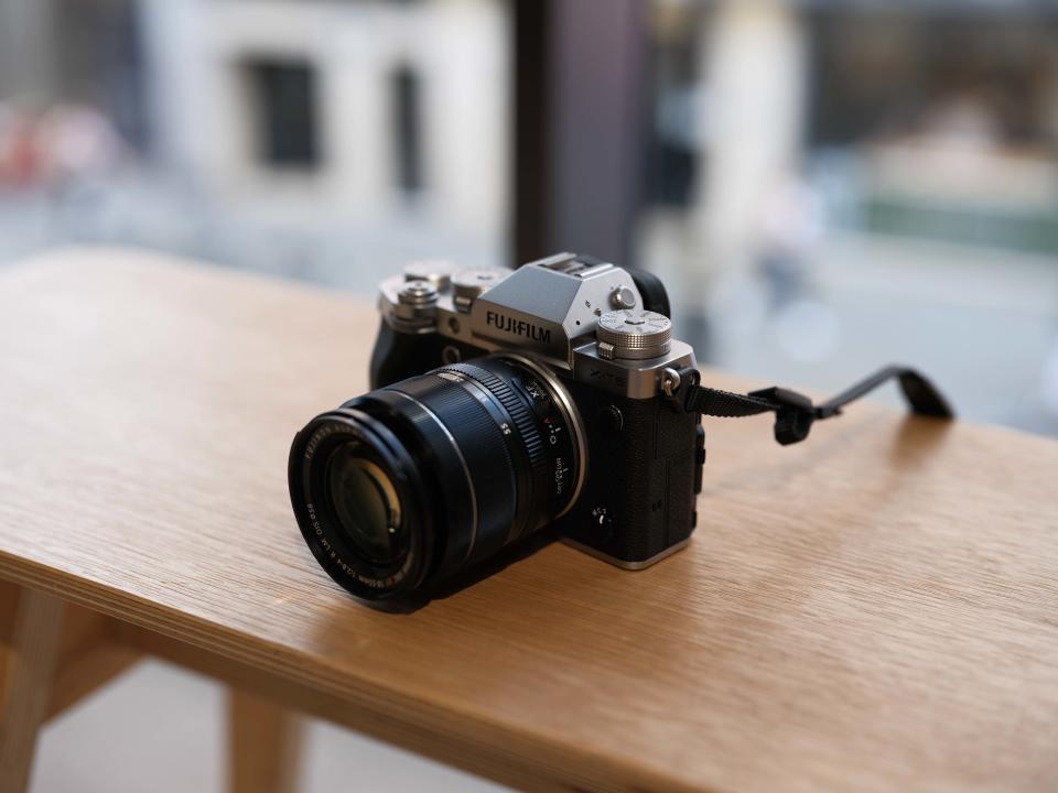 Fujifilm X-T5 camera on a wooden surface