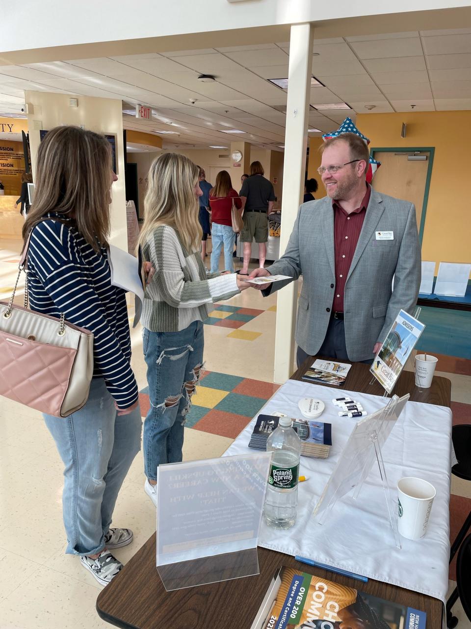 Steve Gorman, Director of Admissions speaks with an interested student at an Open House event.