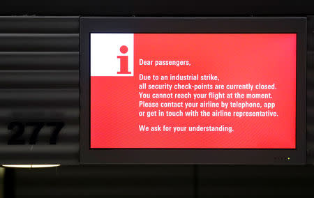 Information is displayed at a closed check-in counter of German airline Lufthansa during a strike by security personnel over higher wages at Germany's largest airport in Frankfurt, Germany, January 15, 2019. REUTERS/Kai Pfaffenbach