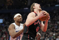 Orlando Magic center Wendell Carter Jr. (34) fouls Toronto Raptors forward Kelly Olynyk (41) during the first half of an NBA basketball game Friday, March 15, 2024, in Toronto. (Frank Gunn/The Canadian Press via AP)