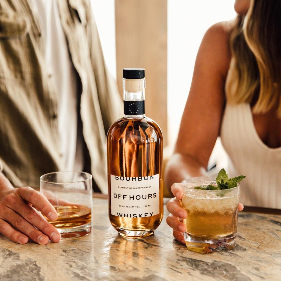 man and woman drinking off hours bourbon in bar