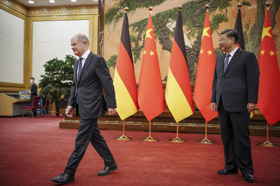 FILE - German Chancellor Olaf Scholz, left, walks as he meets Chinese President Xi Jinping at the Great Hall of People in Beijing, China, on Nov. 4, 2022. In the weeks since Chinese leader Xi Jinping won a third five-year term as president, setting him on course to remain in power for life, leaders and top diplomats from around the world have been beating a path to his door. None more-so than those from Europe. (Kay Nietfeld/Pool Photo via AP, File)