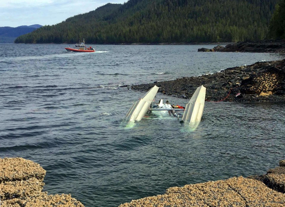 FILE -This May 13, 2019, file photo, provided by Ryan Sinkey, shows a Coast Guard Station Ketchikan response boat crew searching for survivors from a downed floatplane in the vicinity of George Inlet near Ketchikan, Alaska. A preliminary report Released Wednesday, May 22, 2019 says a pilot saw a flash on his left side just before his plane collided another plane in Alaska, killing six people. The National Transportation Safety Board says in the report released Wednesday, May 22, 2019, that the two planes carrying Alaska cruise ship passengers were returning from a flightseeing tour of Misty Fjords when the collision occurred May 13 northeast of Ketchikan. (Ryan Sinkey via AP, File)