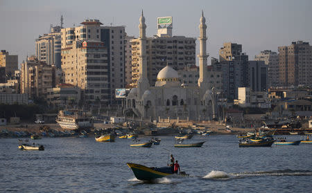 Fishing boats are seen at the seaport of Gaza City August 15, 2018. REUTERS/Ibraheem Abu Mustafa