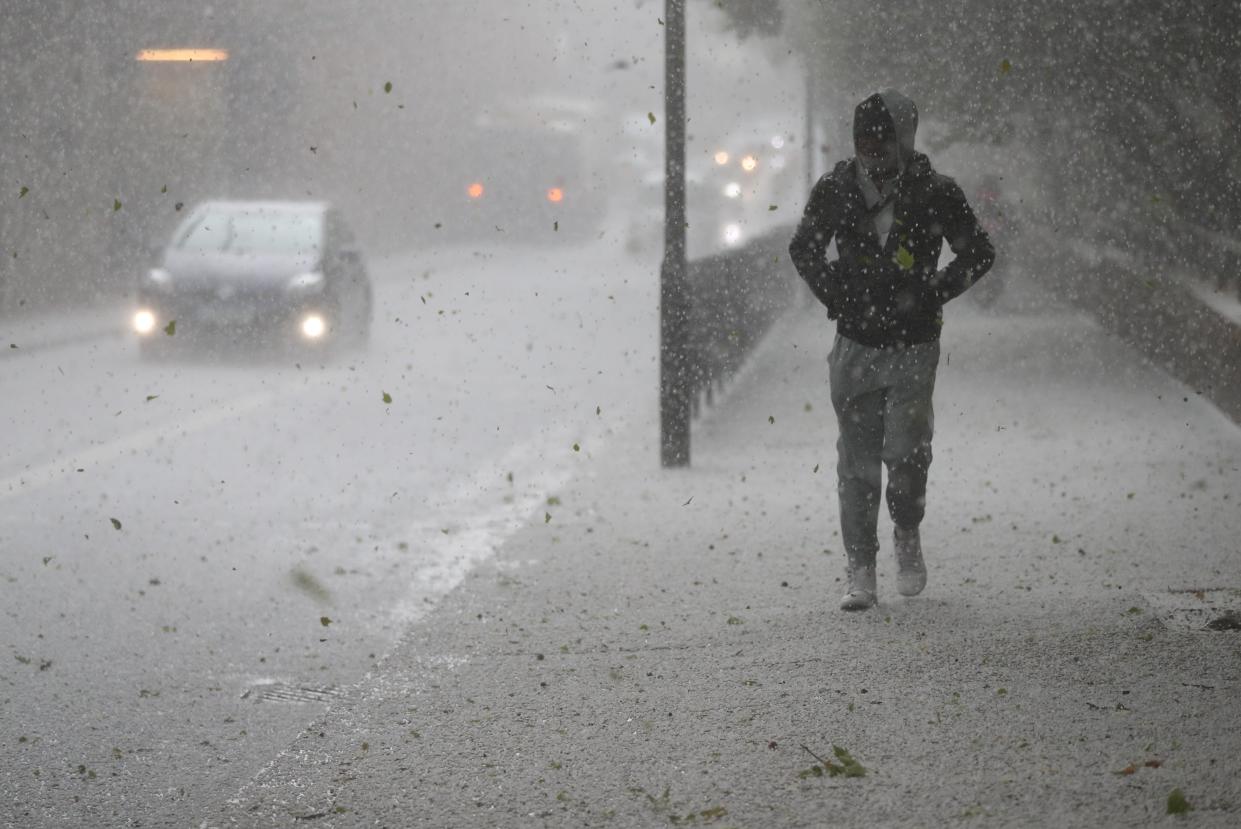 <p>Hail fell on the streets of London</p> (PA Wire)