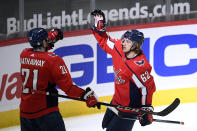 Washington Capitals left wing Carl Hagelin (62) celebrates his goal against the Philadelphia Flyers with right wing Garnet Hathaway (21) during the first period of an NHL hockey Tuesday, April 13, 2021, in Washington. (AP Photo/Nick Wass)