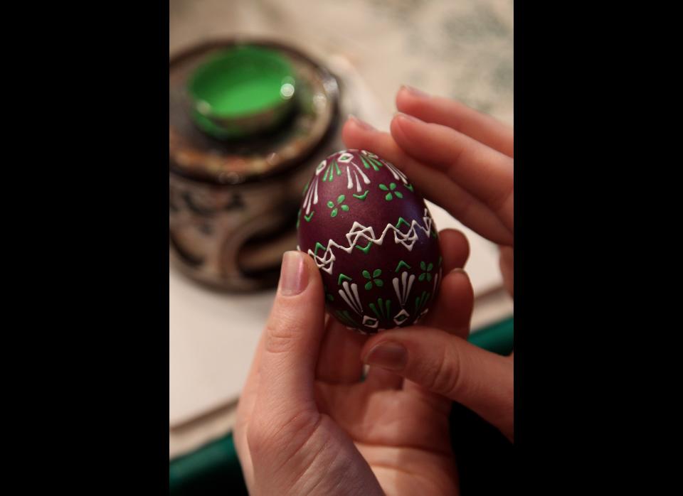 SCHLEIFE, GERMANY - MARCH 21:  An artisan paints an Easter egg in traditional Sorbian motives at the annual Easter egg market on March 21, 2010 in Schleife, Germany. Easter egg painting is a strong part of Sorbian tradition and visual elements within the painting are meant to ward off evil. Sorbians are a Slavic minority in eastern Germany and many still speak Sorbian, a language closely related to Polish and Czech.  (Photo by Sean Gallup/Getty Images)