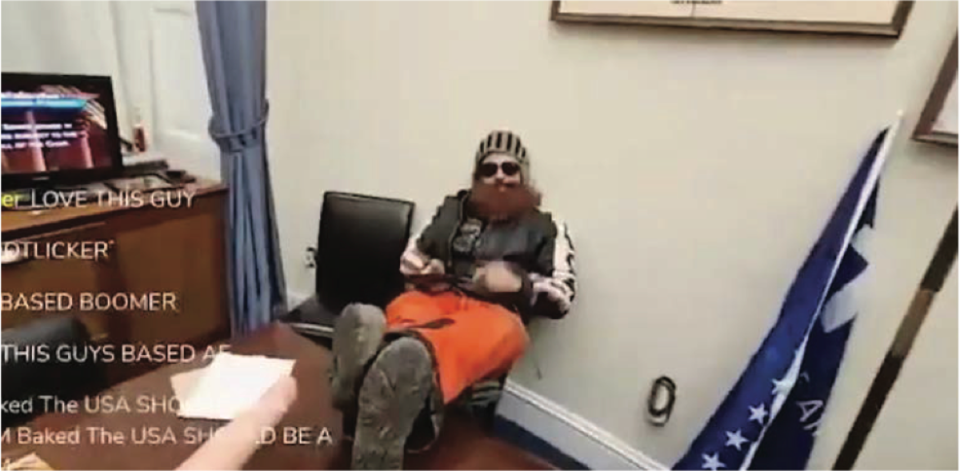 Brandon Fellows, a January 6 rioter, pictured sitting in a Democratic senator’s chair during the Capitol attack (US District Court for the District of Columbia / Affidavit)