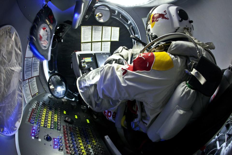 Pilot Felix Baumgartner of Austria steps out from the capsule during the second manned test flight for Red Bull Stratos in Roswell, New Mexico, USA on July 25, 2012. Red Bull Stratos is a mission to the edge of space to an altitude of 37.000 meters to break several records including the sound of speed in freefall. (Photo courtesy Red Bull Stratos)