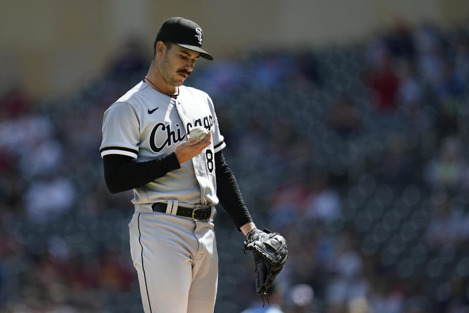 Chicago White Sox starting pitcher Dylan Cease reacts after a run was scored by Minnesota Twins' Michael A. Taylor during the third inning of a baseball game, Monday, April 10, 2023, in Minneapolis. (AP Photo/Abbie Parr)