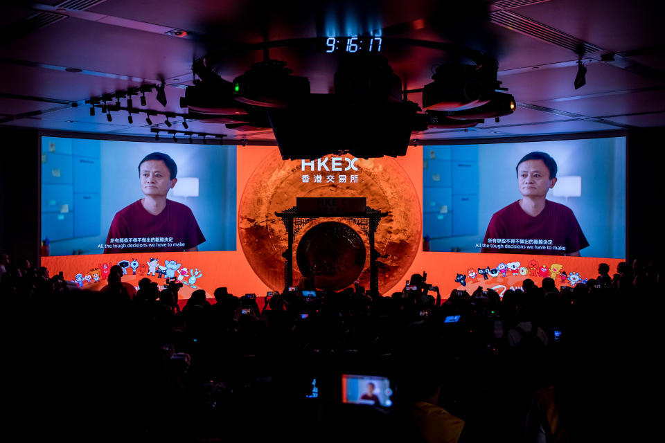 Jack Ma, former chairman of Alibaba Group Holding Ltd., is displayed on screens during the company's listing ceremony at the Hong Kong Stock Exchange in Hong Kong, China, on Tuesday, Nov. 26, 2019. Photo: Paul Yeung/Bloomberg