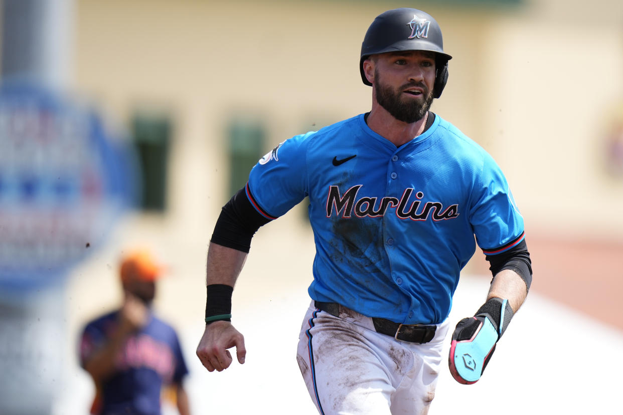 JUPITER, FLORIDA - MARCH 12: Jon Berti #5 of the Miami Marlins runs into third base against the Houston Astros during the second inning of a spring training game at Roger Dean Stadium on March 12, 2024 in Jupiter, Florida. (Photo by Rich Storry/Getty Images)