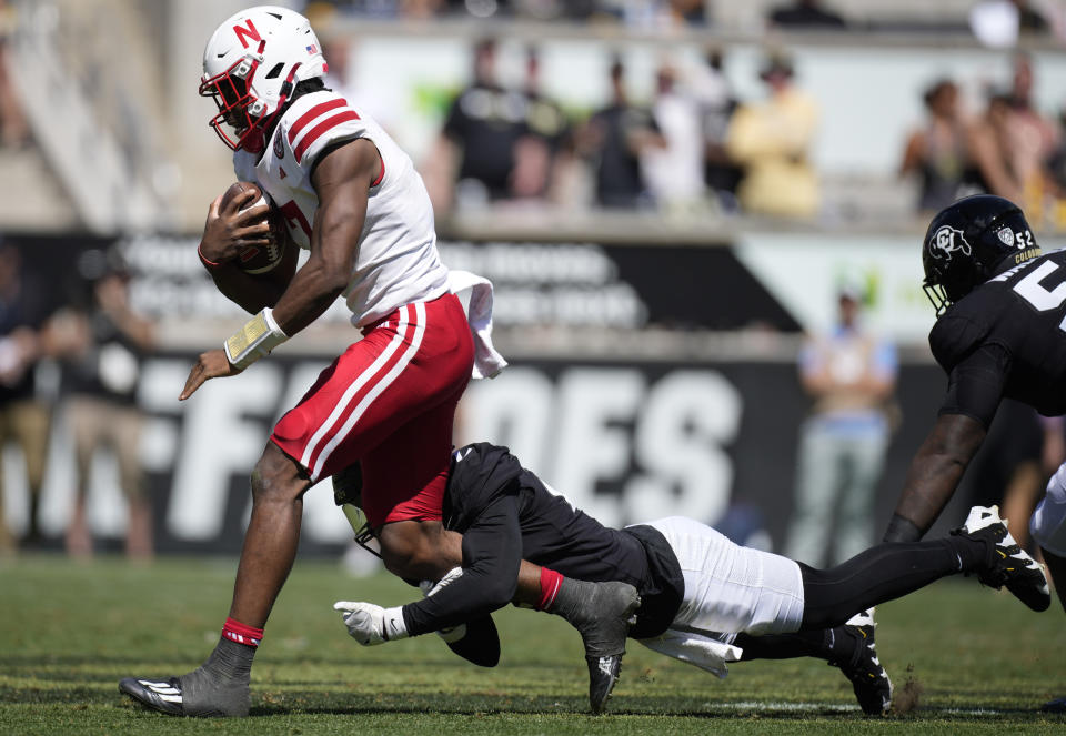 Nebraska quarterback Jeff Sims, left, is tackled after a short gain by Colorado safety Shilo Sanders in the second half of an NCAA college football game Saturday, Sept. 9, 2023, in Boulder, Colo. (AP Photo/David Zalubowski)