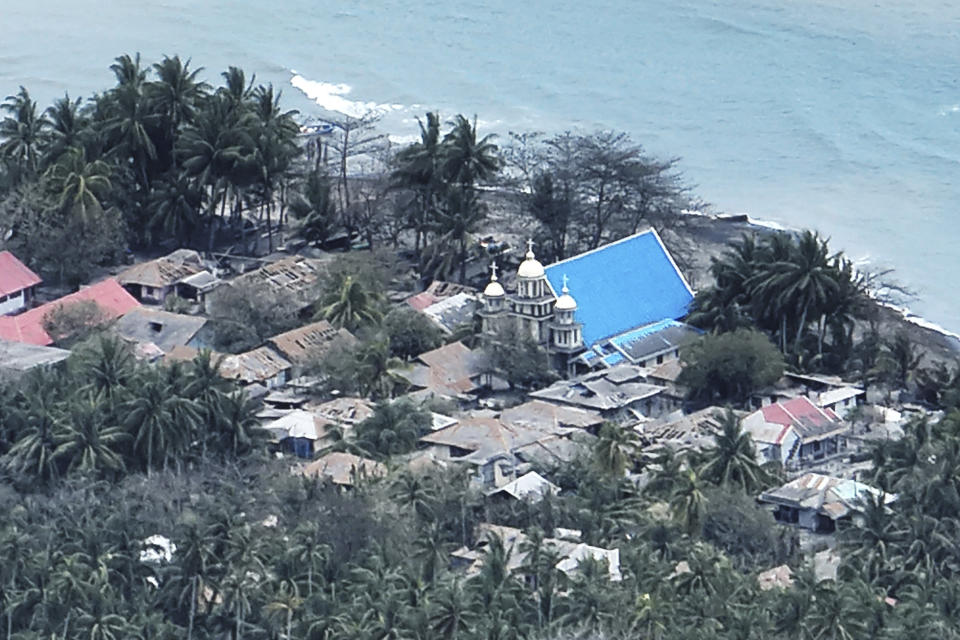 This photo provided by the Indonesian National Search and Rescue Agency (BASARNAS) shows a part of a village on Tagulandang island covered by ash from eruptions of Mountt Ruang in the Sulawesi island, Indonesia, Friday, April 19, 2024. More people living near an erupting volcano on Indonesia's Sulawesi Island were evacuated on Friday due to the dangers of spreading ash, falling rocks, hot volcanic clouds and the possibility of a tsunami. (National Search and Rescue Agency via AP)