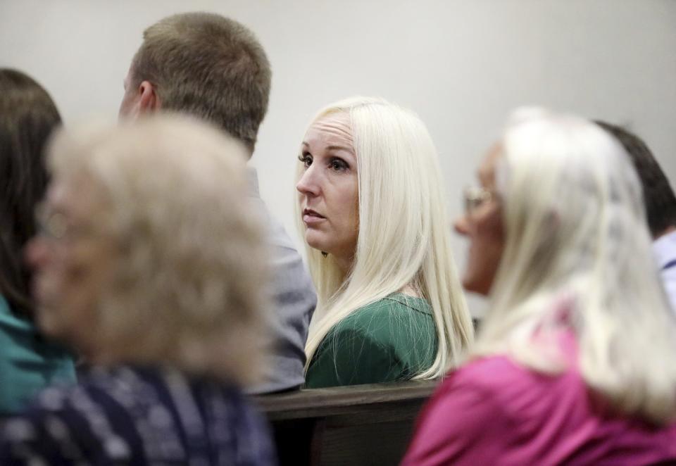 Nicole Oulson, widow of Chad Oulson, is seated in the gallery moments before former Tampa police captain Curtis Reeves is called to give testimony in his defense during his second-degree murder trial on Thursday, Feb 24, 2022, at the Robert D. Sumner Judicial Center in Dade City, Fla. Reeves is accused of shooting and killing Chad Oulson at a Wesley Chapel movie theater in January 2014. (Douglas R. Clifford/Tampa Bay Times via AP, Pool)