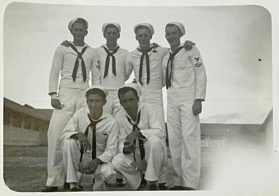 Navy veteran Joseph Jennings, who turned 100 in September, poses with crew mates