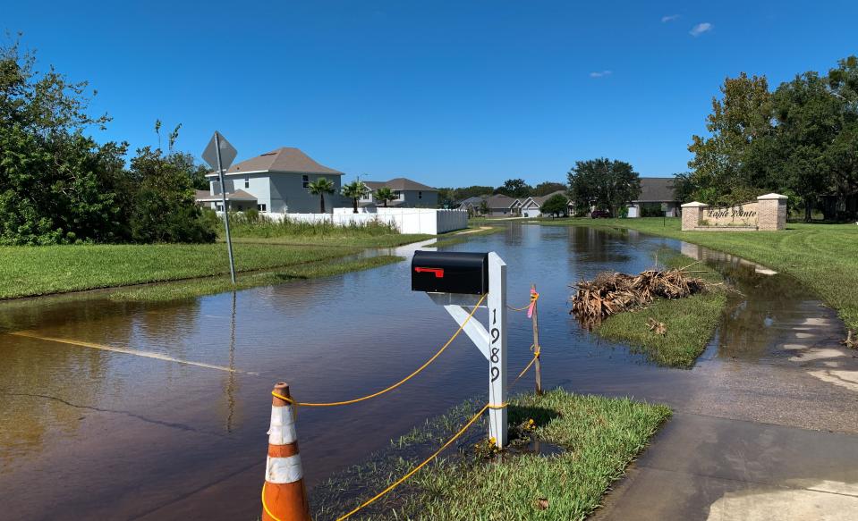 Rains from Hurricane Ian caused flooding along roadways in Eagle Pointe neighborhood in Titusville.