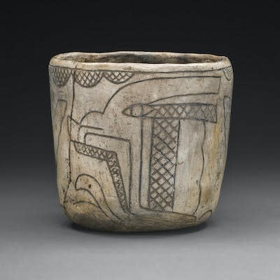 A cup showing the Olmec maize god as growing corn. <a href="https://www.gettyimages.com/detail/news-photo/cup-with-profile-head-of-the-maize-god-800-400-b-c-artist-news-photo/1354961422?adppopup=true" rel="nofollow noopener" target="_blank" data-ylk="slk:Heritage Art/Heritage Images via Getty Images;elm:context_link;itc:0;sec:content-canvas" class="link ">Heritage Art/Heritage Images via Getty Images</a>