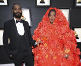 <p>Lizzo's beau Myke Wright opted for a classic tuxedo look, letting his Grammy-nominated date take the spotlight in her bright Dolce & Gabbana cape ensemble. </p>