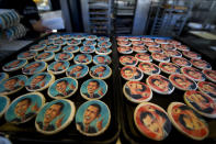 Obama and Romney cookie trays beckon shoppers at the Oakmont Bakery on November 6, 2012 in Oakmont, Pennsylvania. Cookie purchase polls reveal customers have purchased 2,332 Romney cookies while 1,745 Obama cookies have been sold. As Americans are heading to the ballots, polls show that U.S. President Barack Obama and Republican presidential candidate Mitt Romney are in a tight race. (Photo by Jeff Swensen/Getty Images)