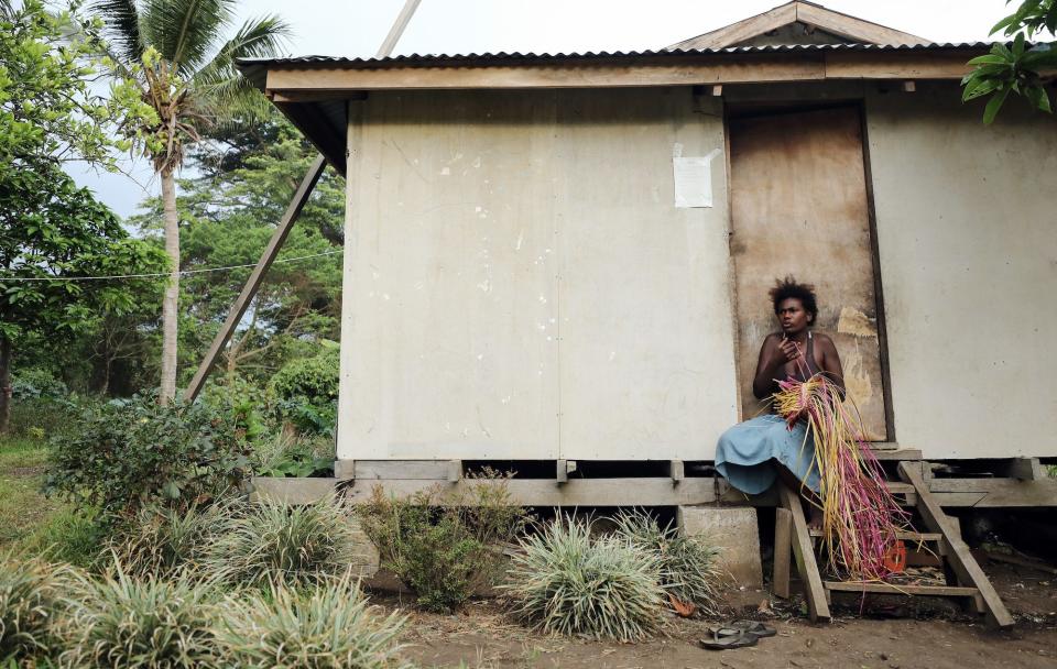 Larisa Josiah weaves a traditional bag made from pandanus fronds on December 05, 2019 in Tanna, Vanuatu.