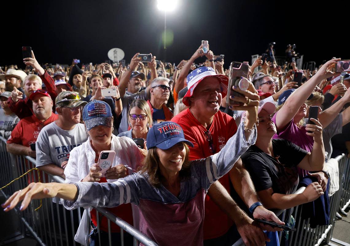The crowd reacts as former president Donald Trump takes the stage during a rally at Wilmington International Airport on Friday, Sept. 23, 2022.