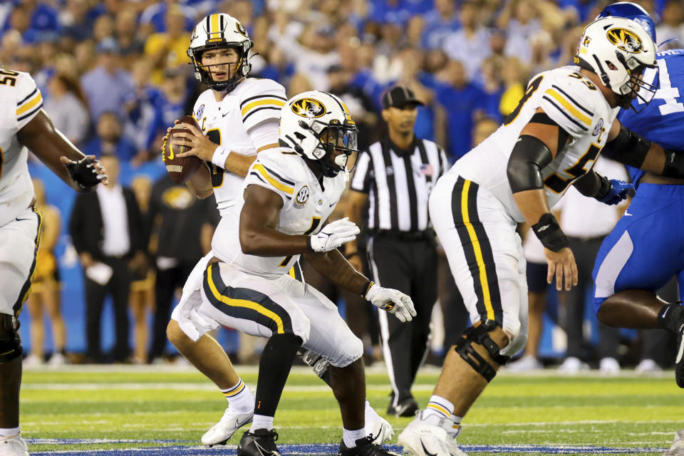 Missouri quarterback Connor Bazelak (8) looks for an open receiver during the first half of an NCAA college football game against Missouri in Lexington, Ky., Saturday, Sept. 11, 2021. (AP Photo/Michael Clubb)