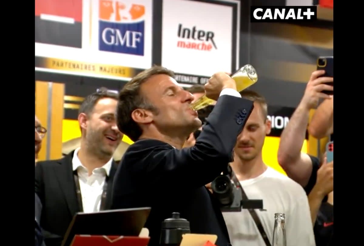 Emmanuel Macron downs a beer in 17 seconds at a rugby club in France (Canal+/Screengrab)