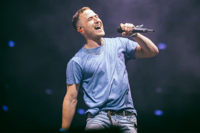 <p>Matt Winkelmeyer/Getty</p> Mike Posner performs in Indio in April 2022