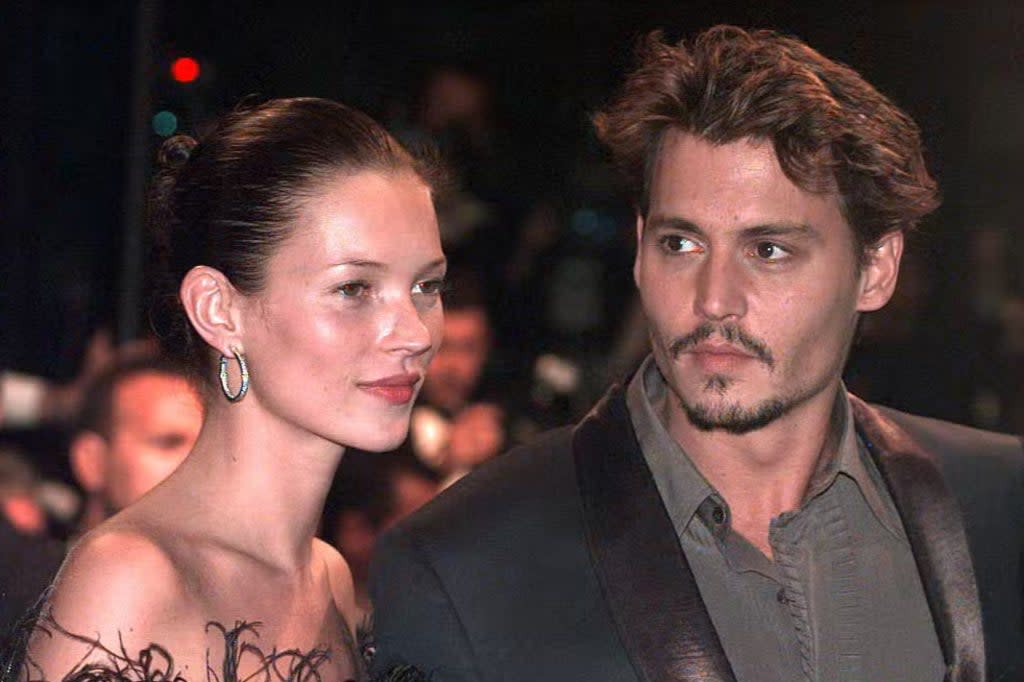 British supermodel Kate Moss with Johnny Depp who she dated in the 1990s (PA Archive)