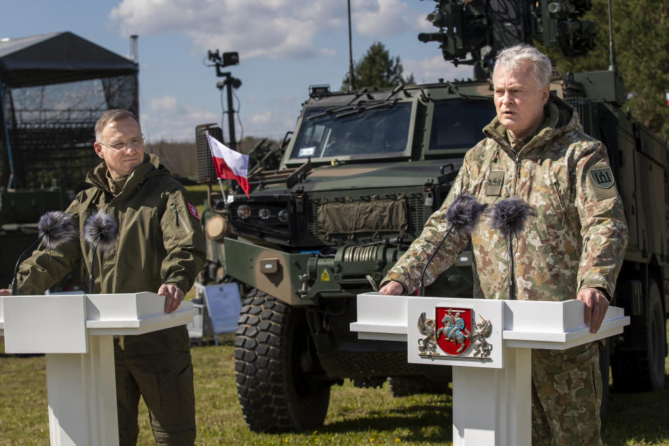 Lithuania's President Gitanas Nauseda, right, speaks during a joint media conference with Poland's President Andrej Duda, during the Lithuanian-Polish Brave Griffin 24/II military exercise near the Suwalki Gap at the Dirmiskes village, Alytus district west of the capital Vilnius in Lithuania on Friday, April 26, 2024. The week-long military exercise which started April 22, is to test a defense scenario on the bilateral so-called “Orsha” plan to defend the Suwałki Gap, a corridor of almost 100 kilometers (62 miles) between the two NATO members Poland and Lithuania. (AP Photo/Mindaugas Kulbis)