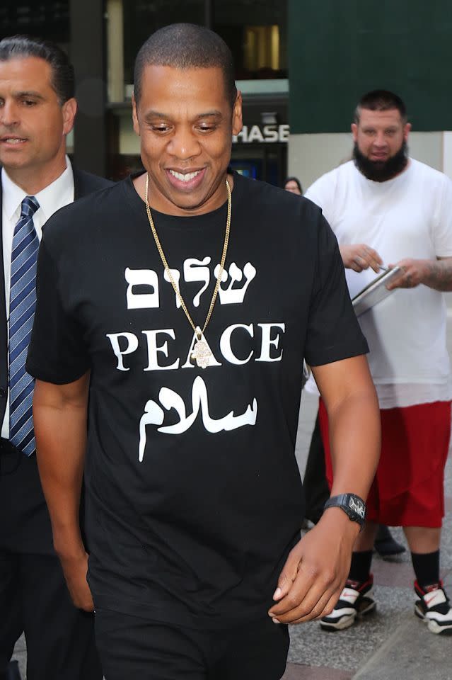 Jay Z in all black with a graphic t-shirt.