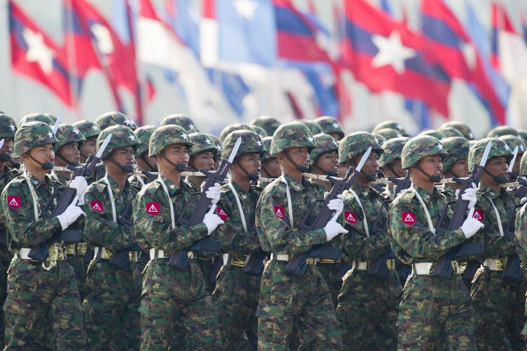 Members of Myanmar's military march in formation during a ceremony to mark the 70th anniversary of Armed Forces Day in the capital Naypyidaw on March 27, 2015