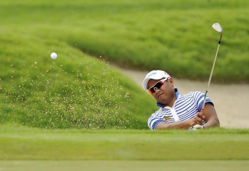 This handout photo, provided by World Sport Group on November 9, shows Chapchai Nirat of Thailand hitting a shot during day two of the Barclays Singapore Open golf tournament at the Sentosa Golf Club in Singapore. Nirat led on six-under-par 65 on the demanding course on Friday, one better than Denmark's Thomas Bjorn, with Simon Khan, Pablo Martin and Chinnarat Phadungsil a stroke further back