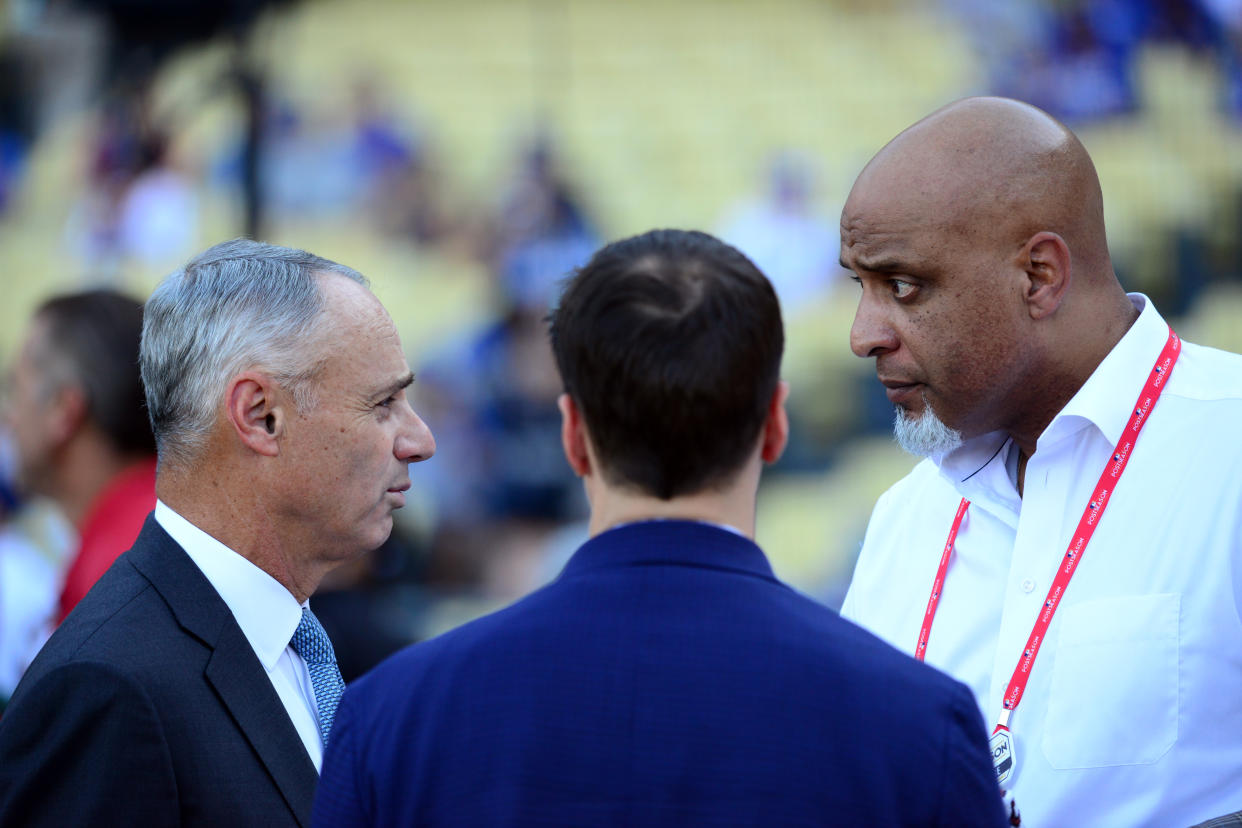 LOS ANGELES, CA - OCTOBER 25:  Major League Baseball Commissioner Robert D. Manfred Jr. talks with Executive Director of the Major League Baseball Players Association Tony Clark during batting practice prior to Game 2 of the 2017 World Series between the Houston Astros and the Los Angeles Dodgers at Dodger Stadium on Wednesday, October 25, 2017 in Los Angeles, California. (Photo by LG Patterson/MLB via Getty Images) 