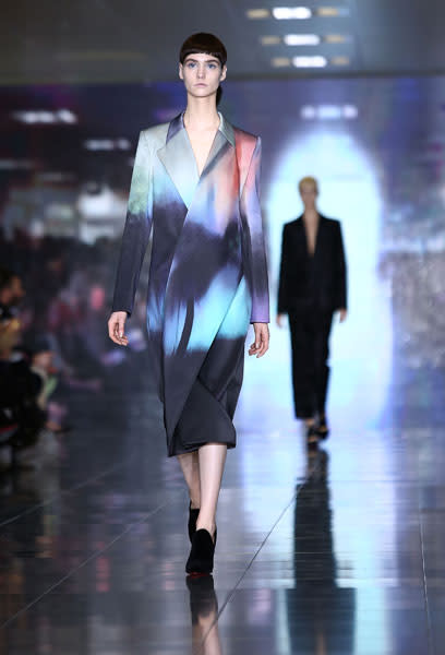 <b>LFW AW13: Mary Katrantzou </b><br><br>Models covered up in oversized dip dye blazers.<br><br>© Getty