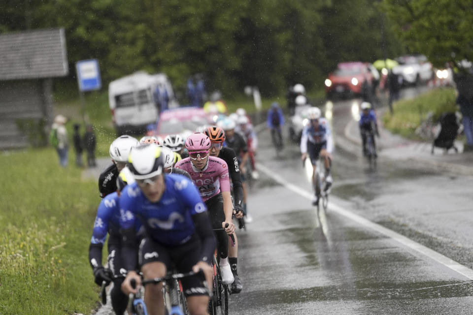 Slovenia's Tadej Pogacar, wearing the pink jersey of the race overall leader, pedals in the pack during the 16th stage of the Giro d'Italia cycling race, from Livigno to Santa Cristina Val Gardena (Monte Pana) Italy, Tuesday, May 21, 2024. (Fabio Ferrari/LaPresse via AP)